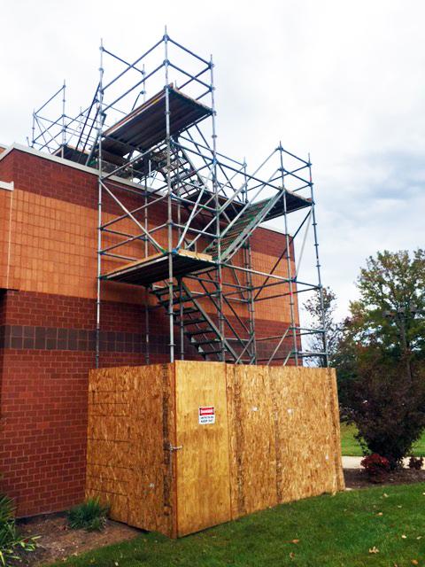 Scaffolding was put on the side of the auditorium to begin installation of the solar panels on the school.
