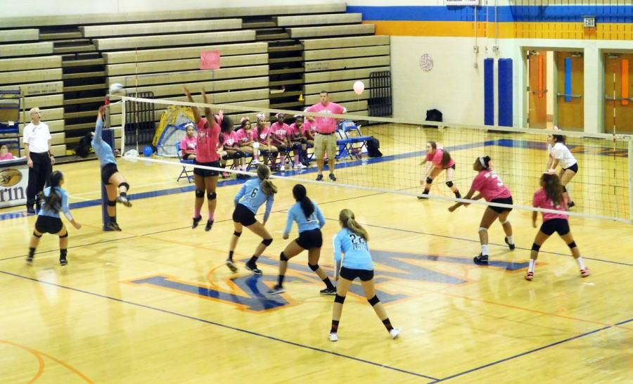 The girls battle it out against Clarksburg High School in their annual Dig Pink game