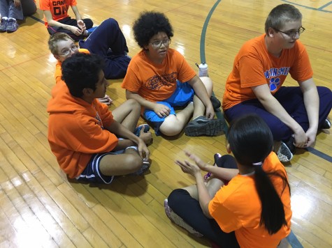 Freshman Victor Quintanilla working with a group in his PE class