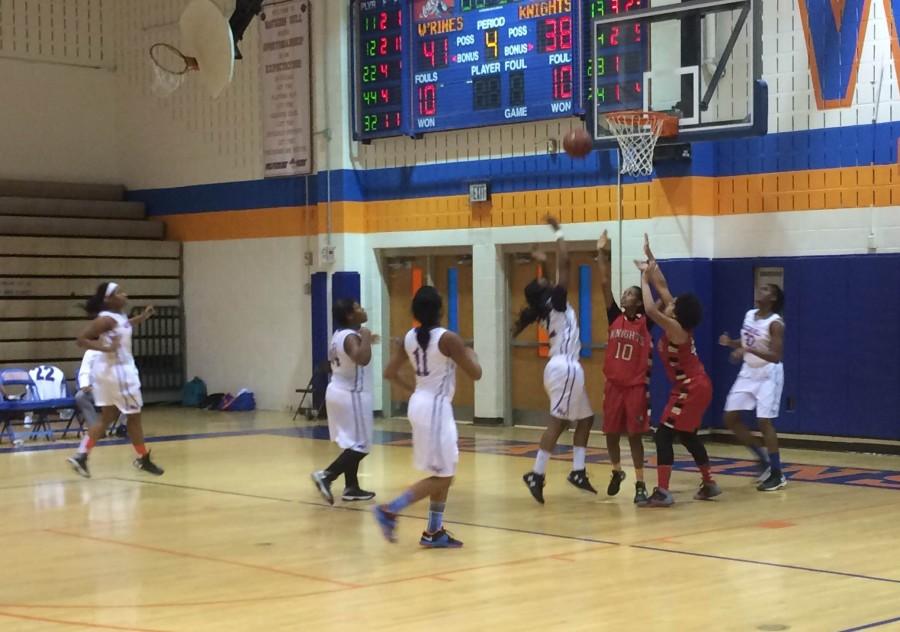 Sophomore Princess Frazier shoots a buzzer beater to win against the Wheaton Knights on Monday.