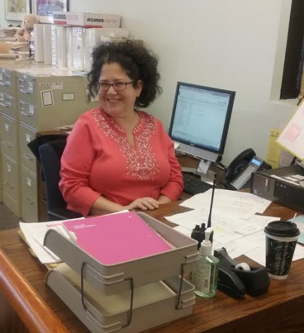 New main office secretary greets visitors with smiles, quirky sense of humor