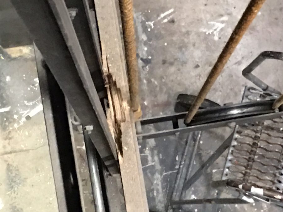 The damaged fly bar support beam above the theatre stage before it was fixed.