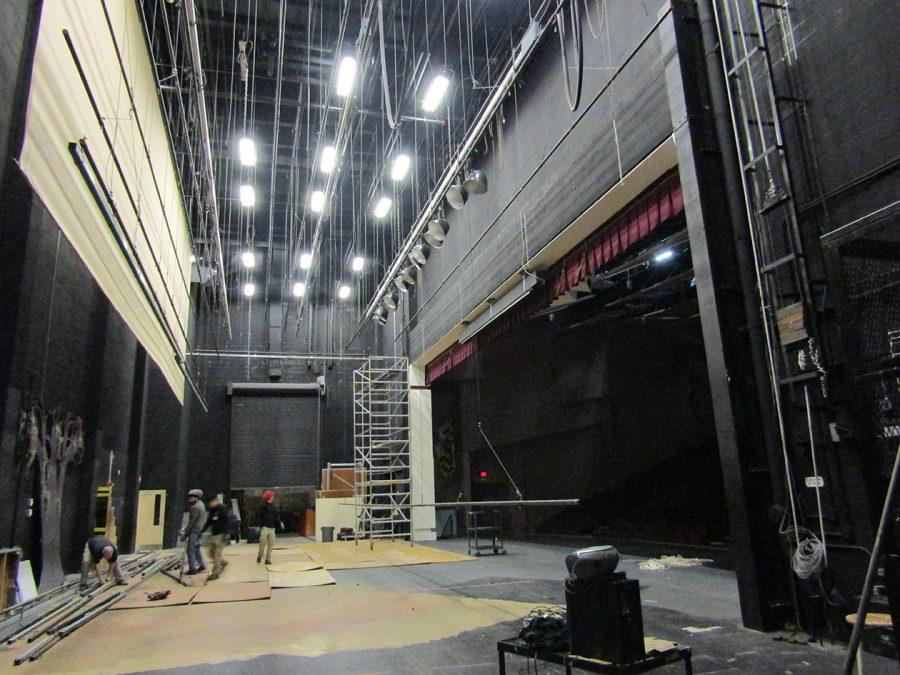 Workers+begin+construction+on+the+new+stage+rigging.+