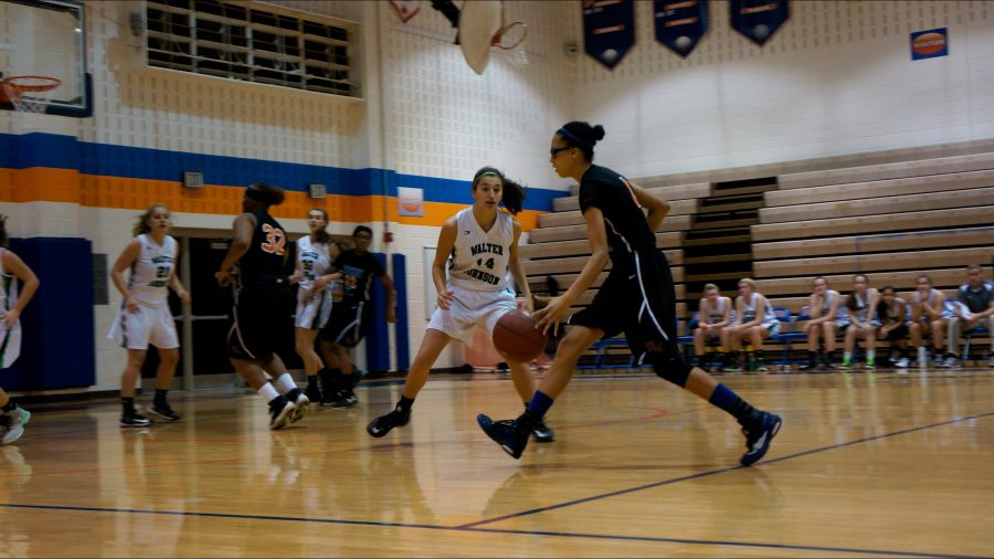 Jada Thorton moves the ball down the court