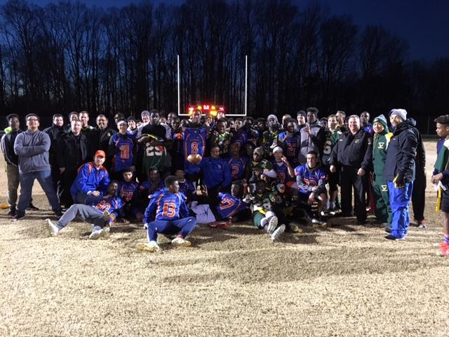 The Wolverine and Screamin' Eagles teams pose together after the game