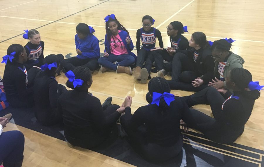 Watkins Mill Poms wait for results at Northwest Highs school