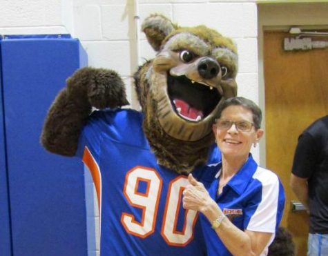 Principal Carol Goddard cheeses with the mascot.  Do you know his name?