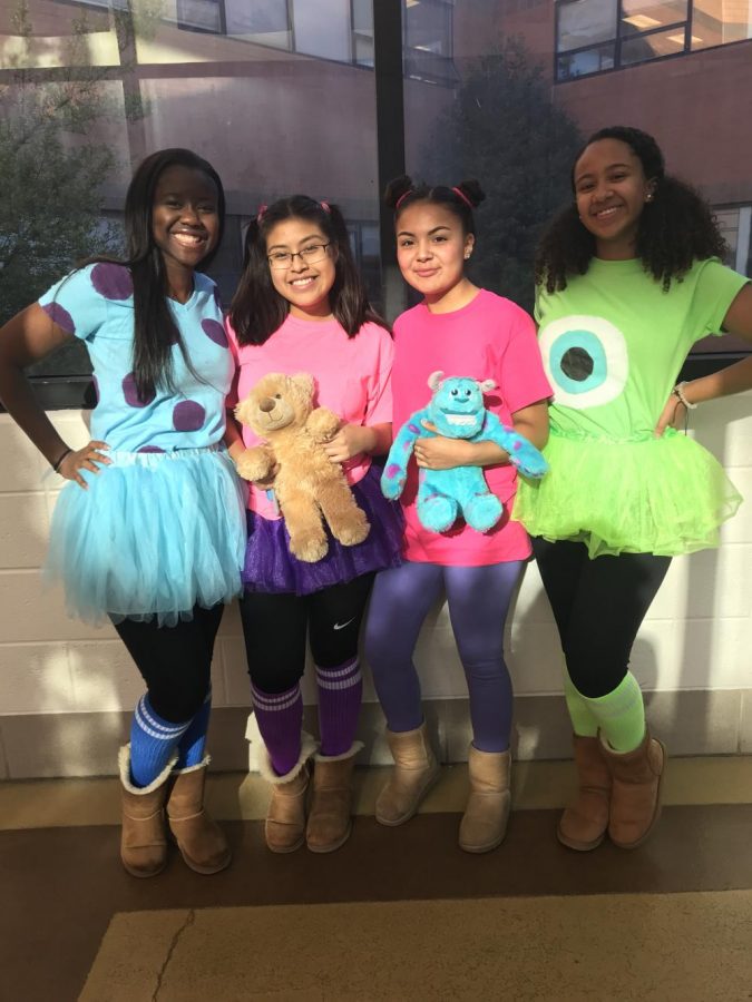 Sully (Eudel Ndong), Boo #1 (Dariana Girao Contreras), Boo #2 (Vikki Batres Jandres), Mike (Christina Cordero) dress as the cast of Monsters, Inc for tv and movie character day