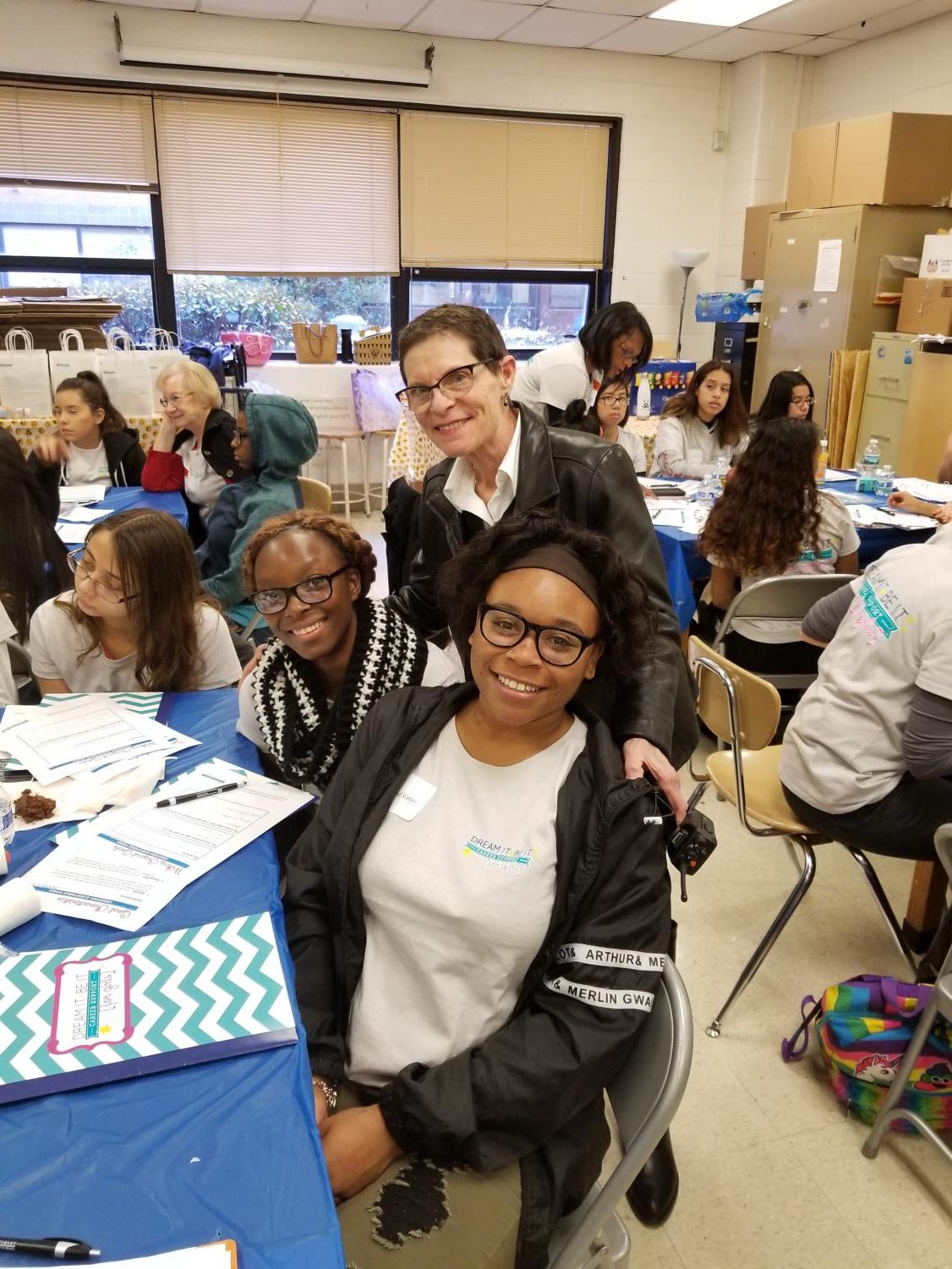 Principal Carol Goddard with two girls that attended the