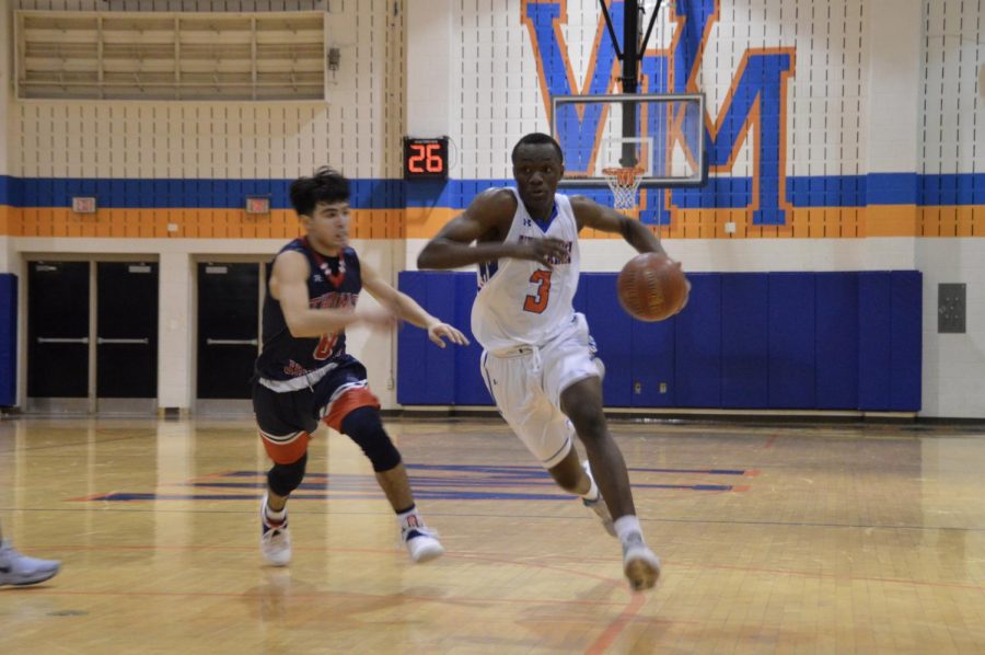 Junior Papito Kalabu drives into the paint. 