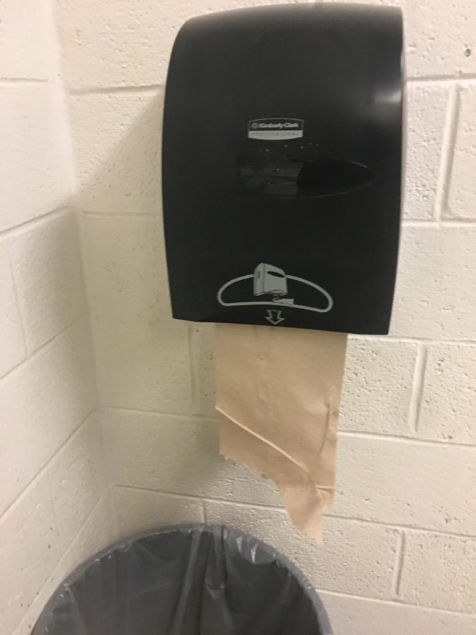 Motion-sensor paper towel dispensers were recently installed in bathrooms to help reduce paper waste.