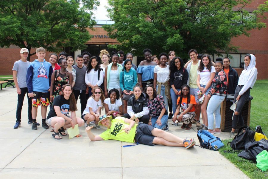 The students who got straight As all year pose in front of Watkins Mill with chaperones Lauren Squier and Matt Johnson before leaving for the National Zoo