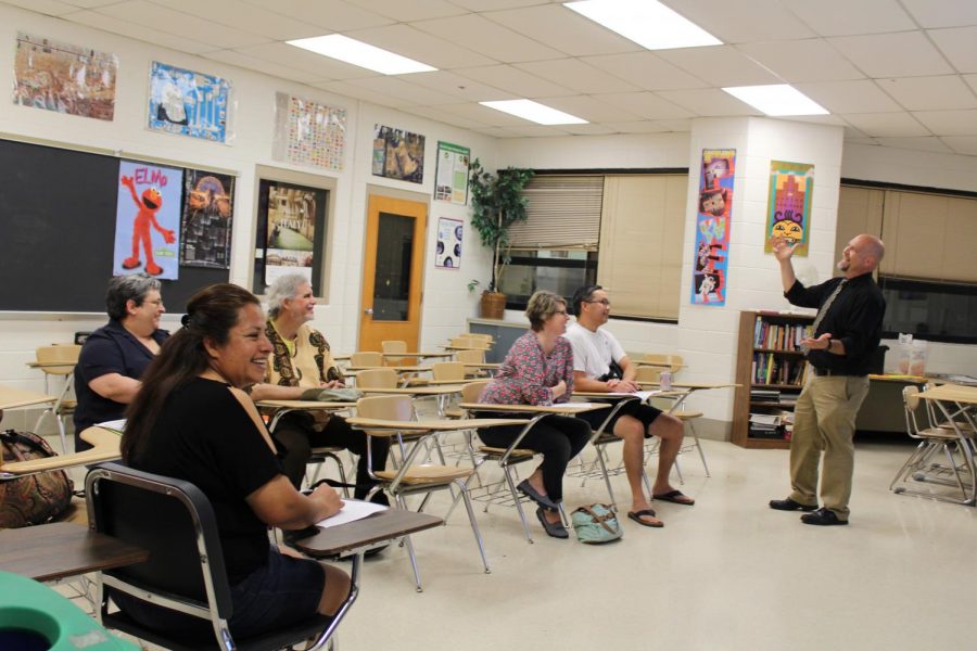 Social+studies+teacher+Will+Funk+shares+a+laugh+with+his+students+parents