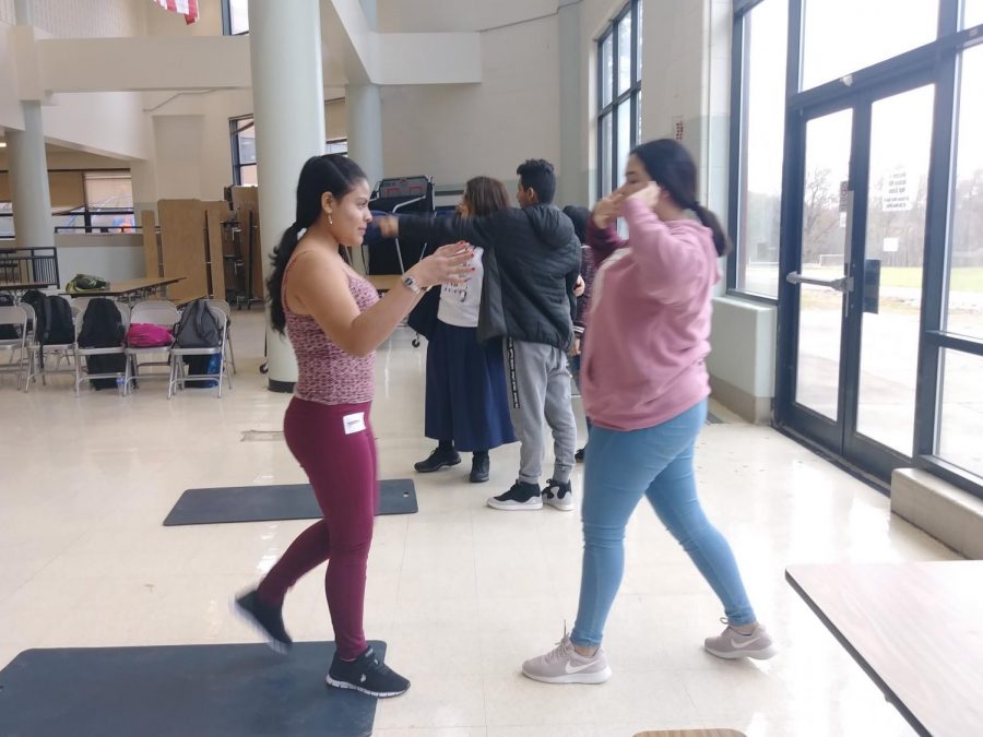 Students using their skills in stage combat by practicing what theyve learned.