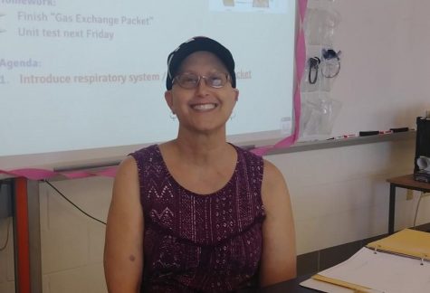 Science teacher soldiers on at school while battling breast cancer