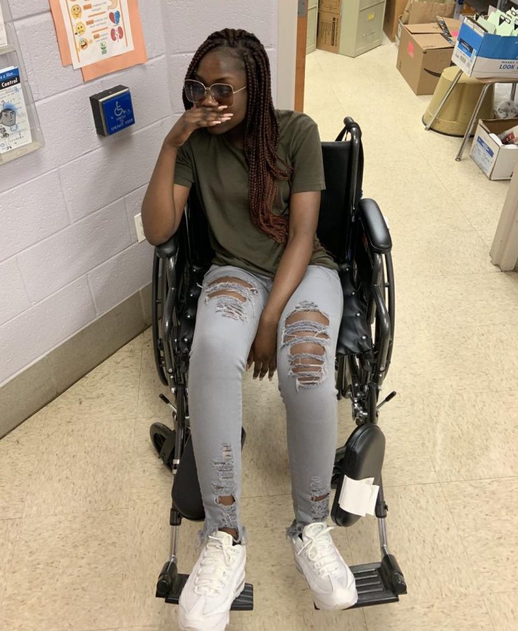 Janice Asabere in a wheelchair after being severely affected by senioritis 