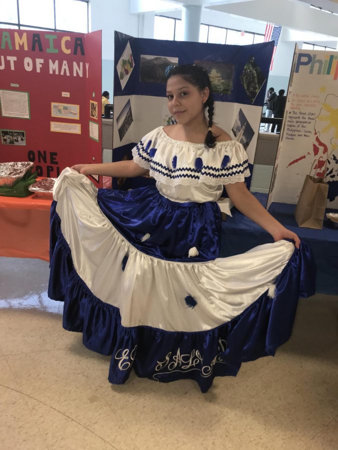 Senior Doereana Hernandez Martinez shows off her dress at International Night on March 14.