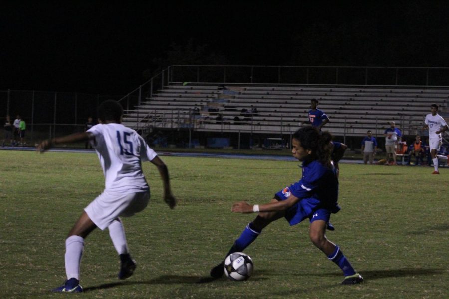 Junior+Carlos+Cordona+dribbles+the+ball+past+a+Springbrook+player.