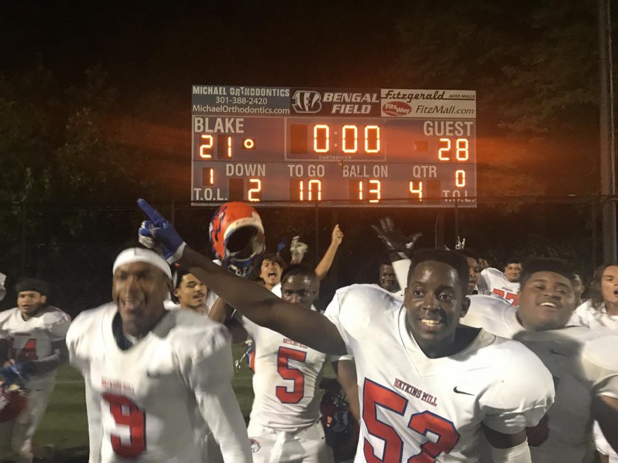 The Watkins Mill High School football team celebrate their win against Blake High School after losing in the previous year.