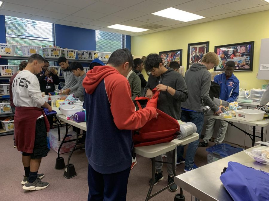 Men of Elites packing backpacks for Comfort Cases