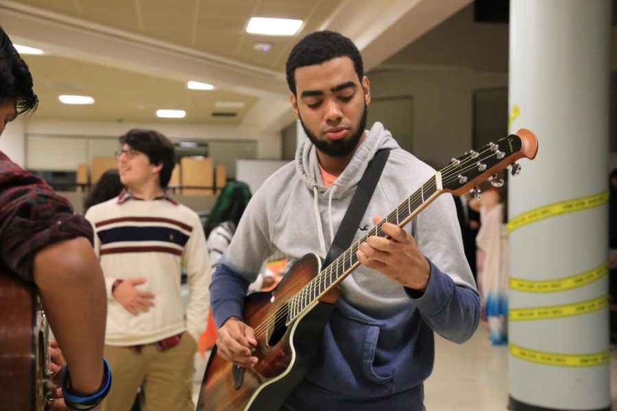 Alumni Xavier Lagual shows his skills with the guitar 