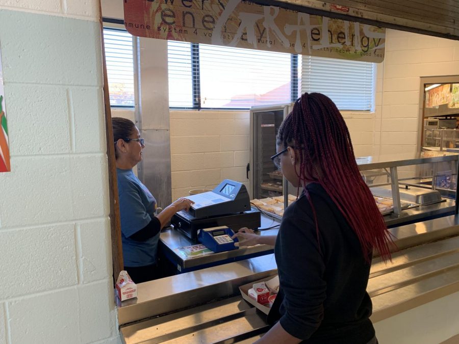 Freshman Destiny Hyman checks out at the after-school supper program, which is available to all students participating in Rec Zone or other extracurricular activities.