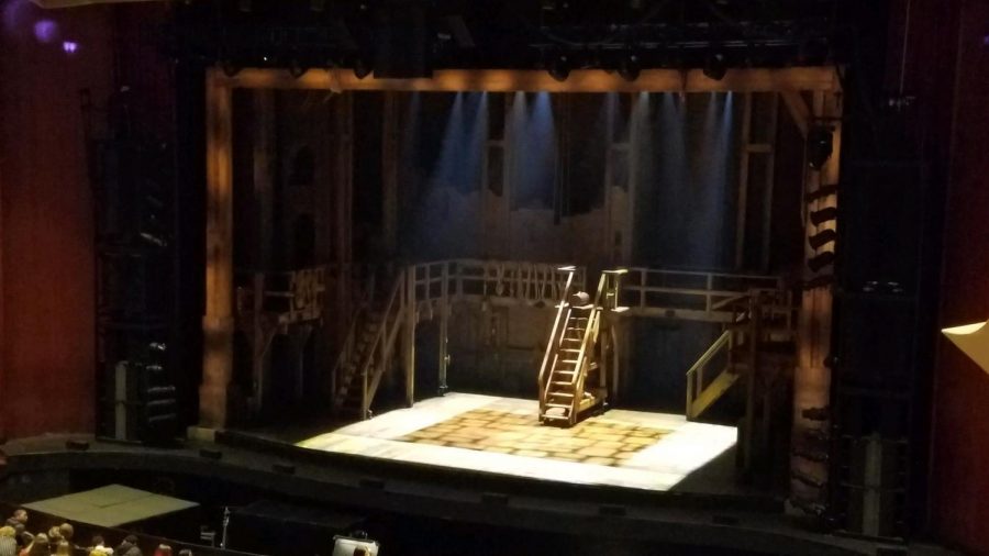 The stage at Chrysler Hall lit in the room where it happens,  waiting for a performance of Hamilton: An American Musical. 