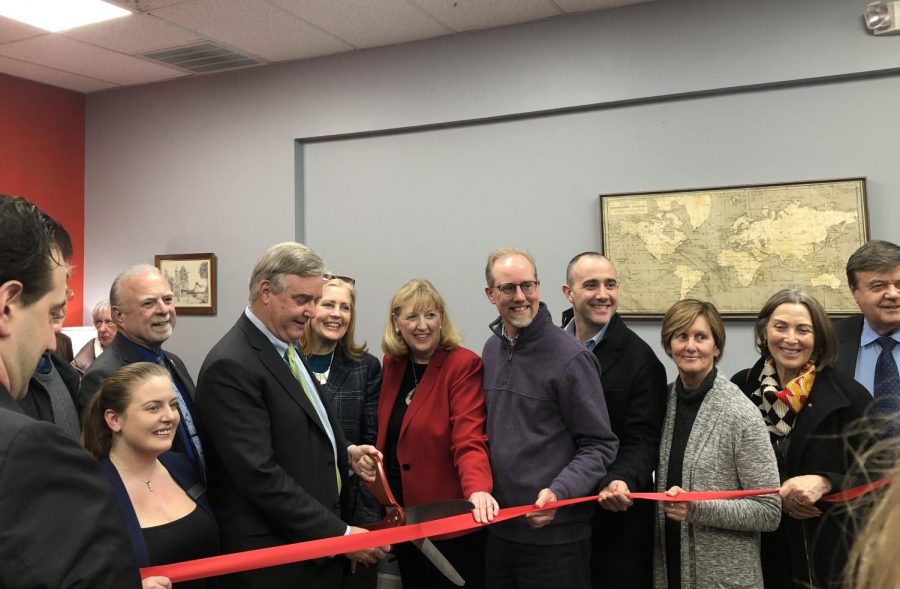 Rep David Trone cutting the ribbon at his Frederick District Office opening. 