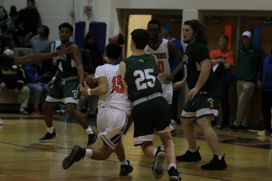 Junior Joseph Crespo dodges a Damascus player.