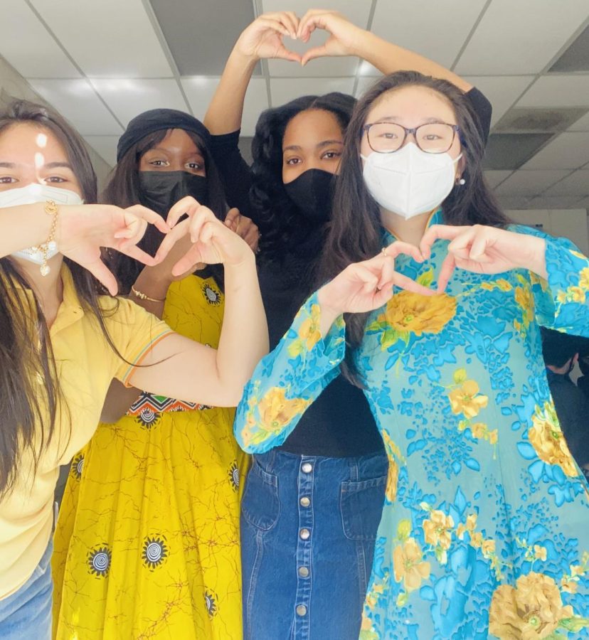 Juniors Andrea Gordon, Sarah Bamba, Rhoda Simms, and Ashley Huynh all pose for a picture showcasing their cultural clothes.