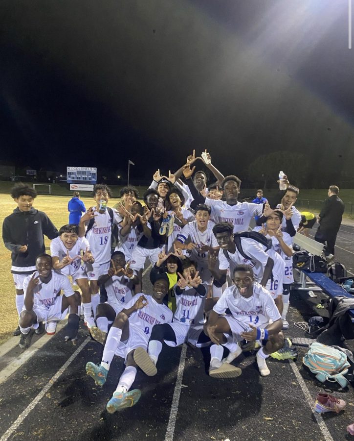 The+varsity+boys+soccer+team+celebrates+their+win+over+the+Magruder+Colonels%2C+former+Regional+Champions%2C+on+Wednesday%2C+October+26.+