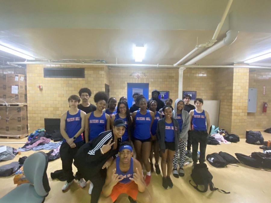 The+indoor+track+team+celebrates+their+performance+at+the+Region+Finals+at+Baltimore+Armory.