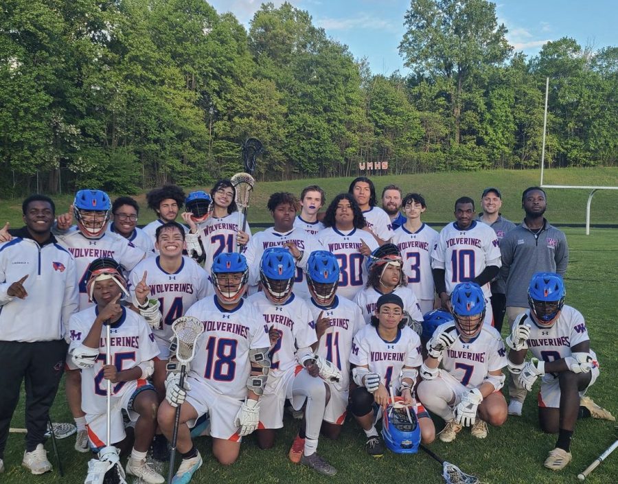 Boys Lacrosse celebrates their first win of the season against the Kennedy Cavaliers on Thursday, May 4.
