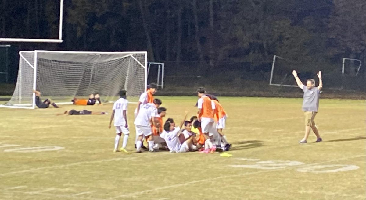 Watkins Mill High School varsity Boys Soccer celebrates their win at the Semi-Finals game against Rockville High School. 
